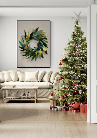 Framed Christmas wreath art hanging above sofa beside decorated tree with gifts in cozy living room.