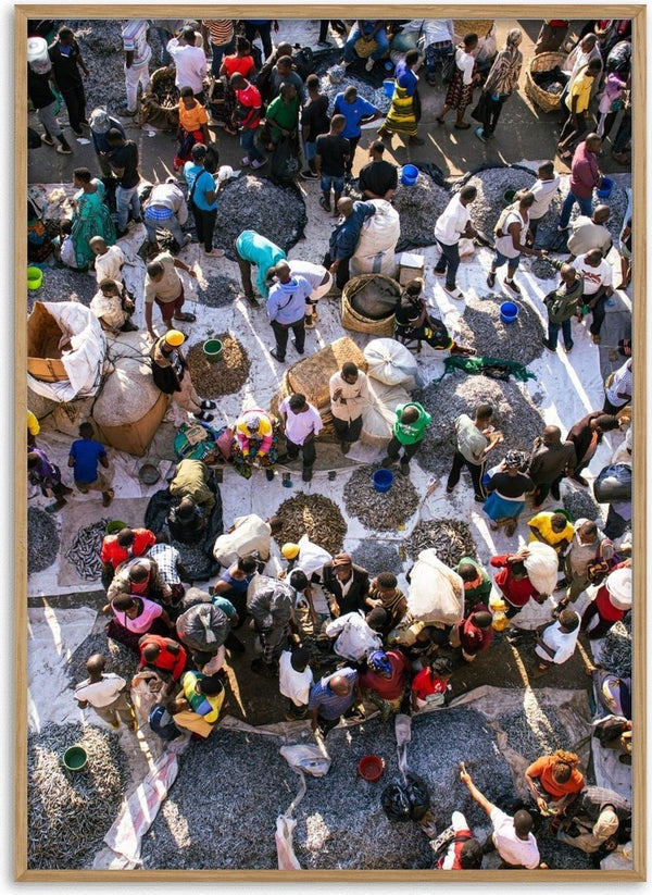 African fish market by Gloria Mwivanda - an aerial view of crowds and drying fish on white tarpaulins