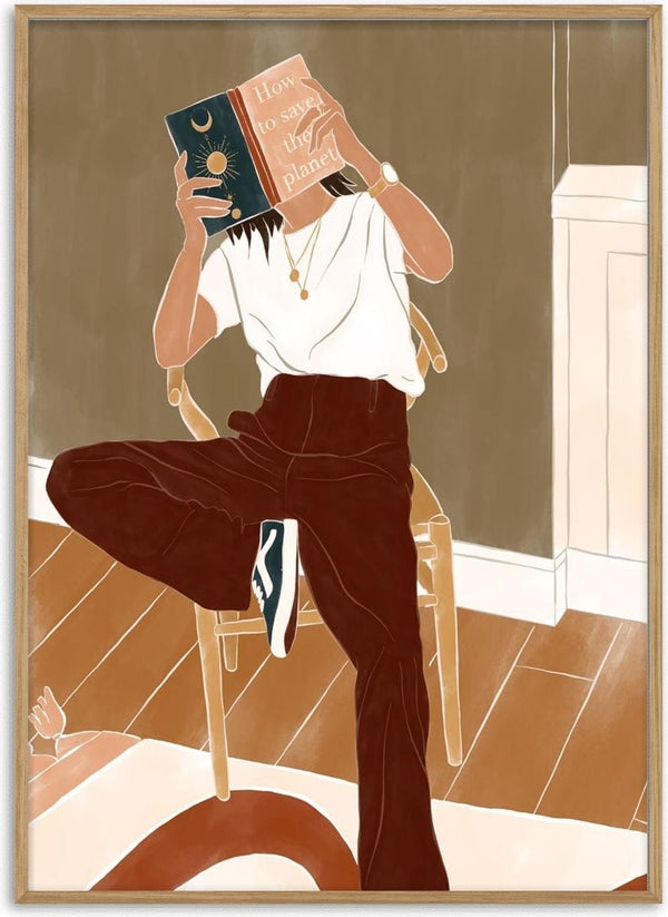 Person reading "How to Save the Planet" by Ivy Green while sitting on a chair in a cozy room.