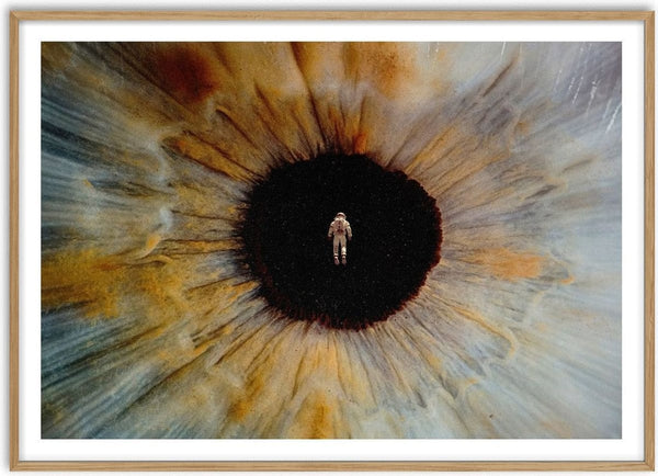 Inner Space by Fran Rodriguez - an astronaut floating in the black pupil of a huge amber and blue eye