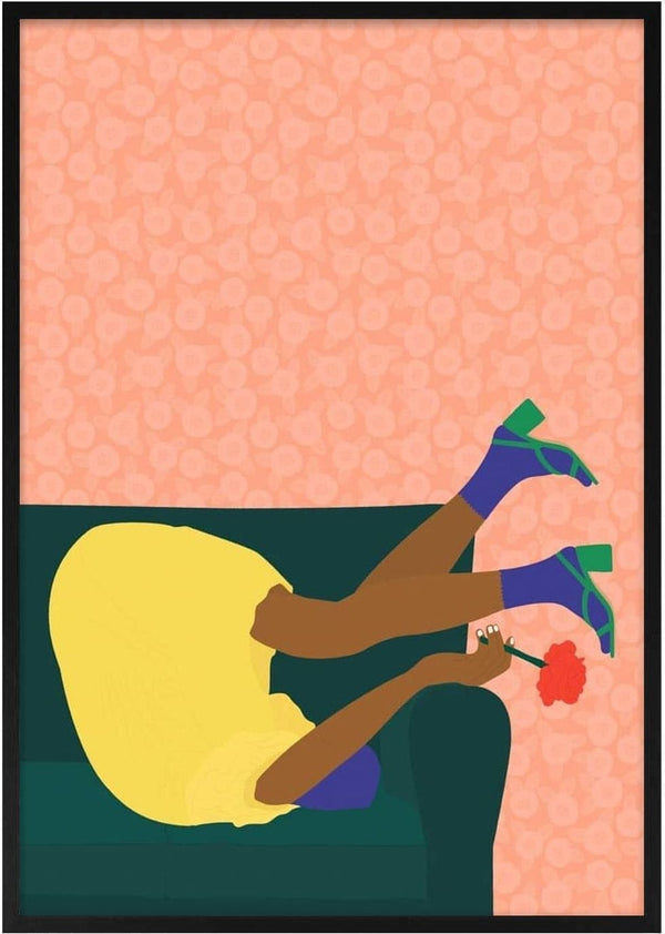 Person in a yellow dress holding a red flower, playfully posing upside down on a sofa for New Year's Eve.