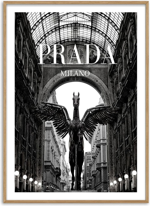 Black and white photo of a winged horse statue under an archway with "PRADA MILANO" text above.