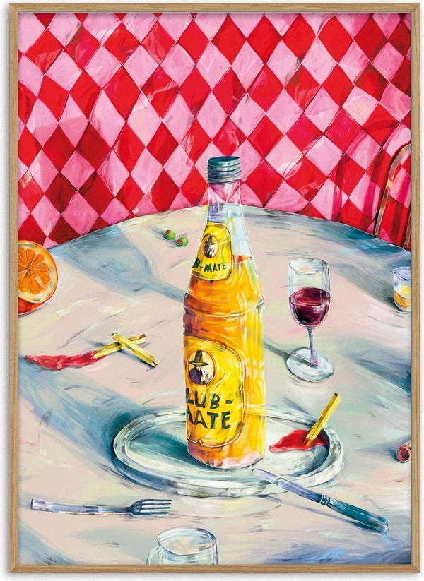 Vibrant Table Still Life by Natascha Baumgärtner – yellow soda bottle, red wine and orange on a café table