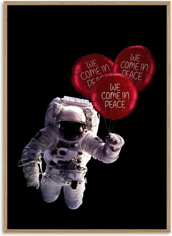 Astronaut floating in space holding three red balloons labeled "We Come In Peace" on a black background.
