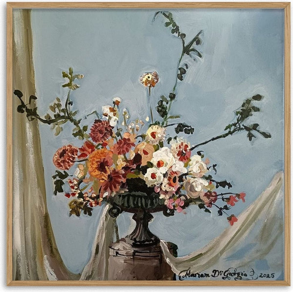 Wedding Arrangement by Mariam De Giorgio - cream roses and coral dahlias in a cast-iron urn on pale blue