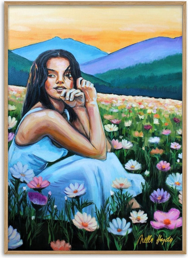 Where Wildflowers Dream by Nella Hajdu - woman in a pale blue dress sitting among white and pink cosmos flowers under an orange sky