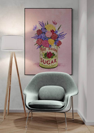Artwork of colorful flowers in a vintage sugar can, displayed above a modern chair on a product page.